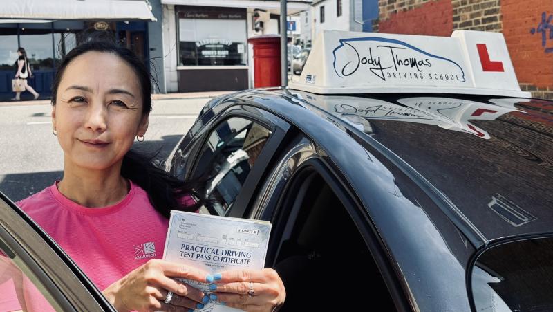 Learner celebrating passing their practical driving test with Jody Thomas Driving School after completing professional driving lessons.